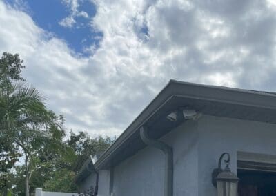 new gutter installed to replace damaged rain gutters