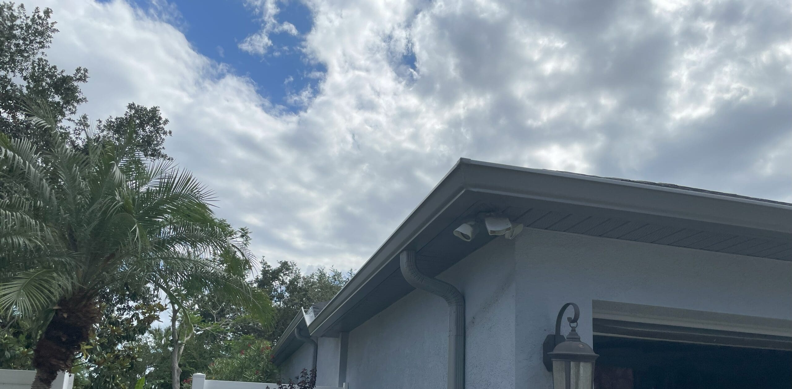 new gutter installed to replace damaged rain gutters