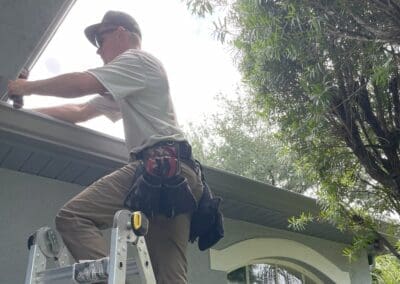 new gutter installed to replace damaged rain gutters