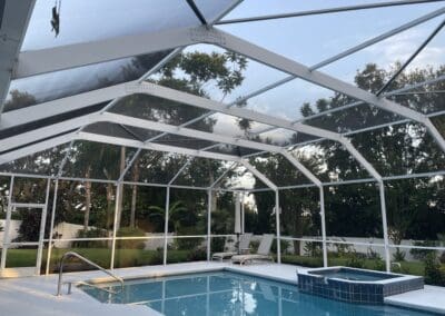 revitalized pool enclosure, where it was re-screened, rusty screws & old hardware replaced. door kits installed and the aluminum enclosure was thoroughly cleaned.