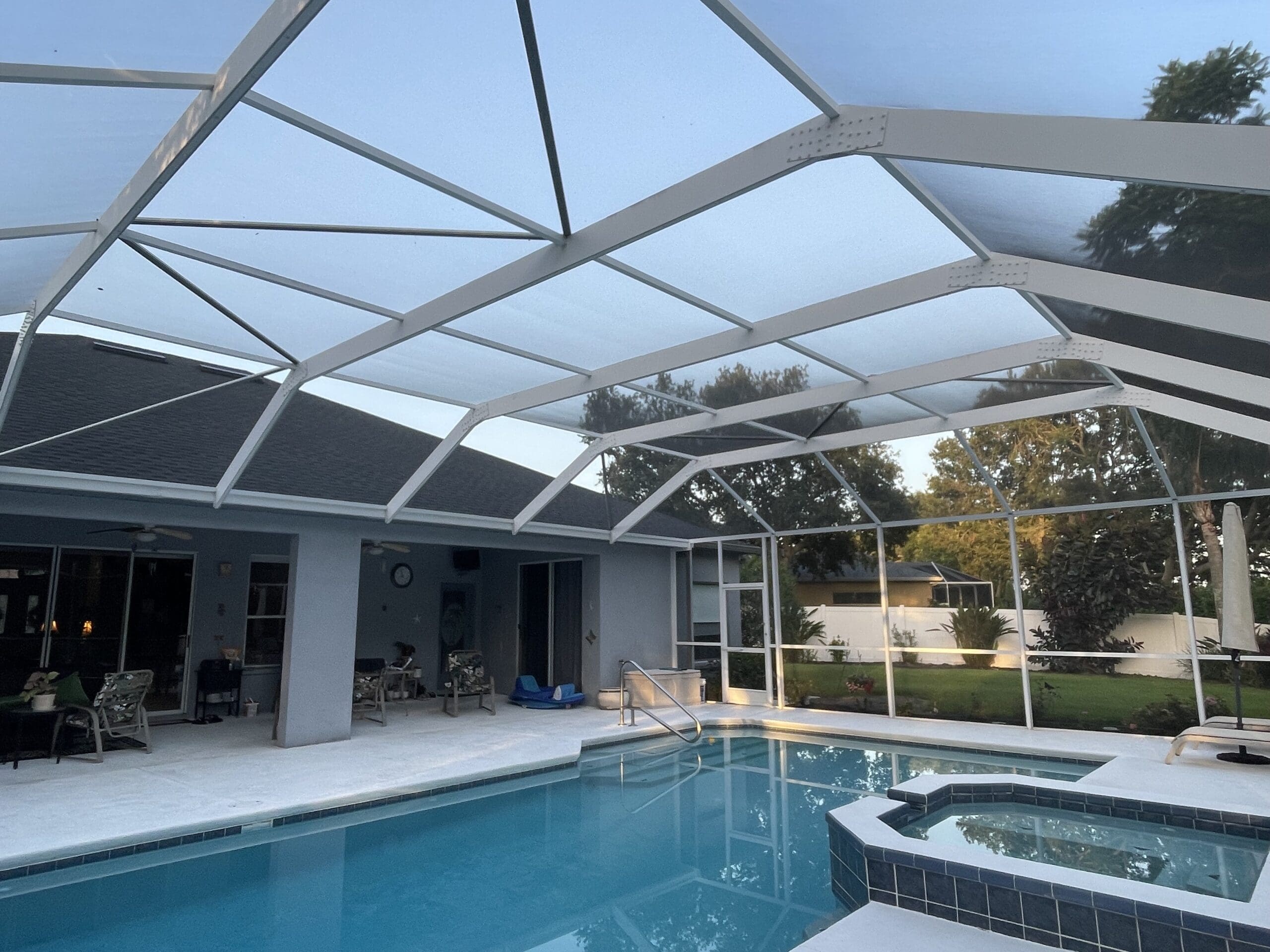 revitalized pool enclosure, where it was re-screened, rusty screws & old hardware replaced. door kits installed and the aluminum enclosure was thoroughly cleaned.