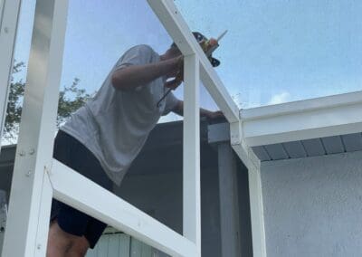 revitalization of screen enclosure by re-screening and replacing rusty screws